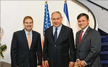  ??  ?? Ohio GOP Rep. Jim Jordan (left) met with Israeli Prime Minister Benjamin Netanyahu (center) this week in Israel, along with Louisiana GOP Rep. Mike Johnson.