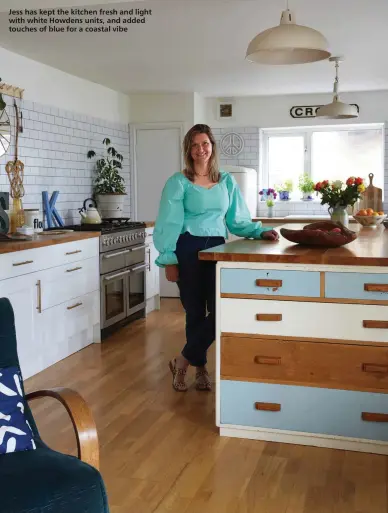  ??  ?? Jess has kept the kitchen fresh and light with white Howdens units, and added touches of blue for a coastal vibe