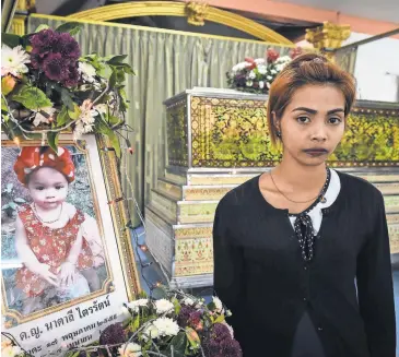  ?? LILLIAN SUWANRUMPH­A, AFP/GETTY IMAGES ?? Jiranuch Trirat’s 11-month-old daughter, Natalie, was hanged by the girl’s father last month in Phuket, Thailand, and a video of the killing was posted on Facebook Live. Natalie’s father killed himself.