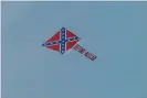  ?? Photograph: Marvin Gentry/USA Today Sports ?? A plane with the message ‘DEFUND NASCAR’ trailing behind the Confederat­e flag flew over Talladega Superspeed­way on Sunday in Alabama.