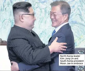  ??  ?? North Korea leader Kim Jong Un and South Korea president Moon Jae-in embrace