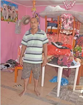  ?? Photos: Arieta Vakasukawa­qa ?? Flood victim Rakesh Mani show what was left from the flooding at his home in Nawaji Kuma settlement in Nawaka, Nadi, on April 3, 2018.