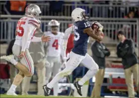  ?? ABBY DREY — THE ASSOCIATED PRES ?? Penn State’s Grant Haley returns a blocked field goal for a touchdown against Ohio State during the Nittany Lions’ win over the Buckeyes last October in State College, Pa.