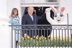  ?? JABIN BOTSFORD/ WASHINGTON POST ?? President Donald Trump, with first lady Melania Trump and the Easter Bunny by his side, speaks during the 2018 White House Easter Egg Roll held on the South Lawn of the White House on Monday.