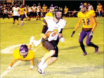  ?? MARK HUMPHREY ENTERPRISE-LEADER ?? Prairie Grove senior wide receiver Isaac Disney steps into the end zone in front of a falling defender with a 2-point conversion pass. Disney caught three passes for 107 yards as the Tigers’ beat Vian, Okla., 35-14, Friday.