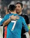  ??  ?? Ronaldo’s efforts earned himself a hug from Juventus goalkeeper Gianluigi Buffon and applause from Italian fans.