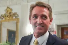  ??  ?? In this July 19 photo, Sen. Jeff Flake, R-Ariz. walks to his seat as he attends a luncheon with other GOP Senators and President Donald Trump at the White House in Washington. AP PHOTO