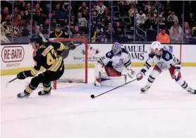  ?? TESSA MCANDREWS/PROVIDENCE BRUINS ?? Providence forward Brett Harrison watches the puck as it goes wide of Hartford goaltender Dylan Garand. Harrison finished Friday's Game 2 with a goal and two assists.