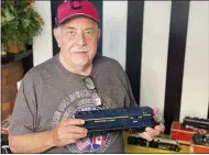  ??  ?? Frank Moritz, of Lakewood, has been collecting trains for 30 years.