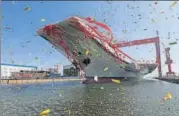  ?? REUTERS ?? China's first domestical­ly built aircraft carrier during its launching ceremony in Dalian, Liaoning province on Wednesday.