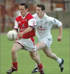  ??  ?? David Reid of Louth showing a clean pair of heels to a Kildare defender in the Leinster Junior Championsh­ip semi-final in Drogheda.