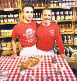  ?? Contribute­d photo ?? For nearly 20 years, Heath Andranovic­h, right, has been creating his New Haven-style gourmet pies with locally sourced ingredient­s using his 100-year-old family recipe at Carmine’s Pizza & Italian Takeout in Durham.