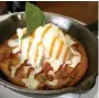  ?? SUPPLIED ?? The Clocktower chocolate chip skillet cookie, topped with vanilla ice cream and caramel.