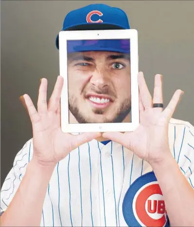  ?? Jamie Squire Getty Images ?? THE NATIONAL LEAGUE most valuable player, Chicago Cubs third baseman Kris Bryant mugs for the camera on photo day during spring training. Still only 25, Bryant is part of the young core of the World Series champions.