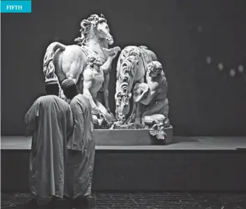  ??  ?? Febin Thomas took his winning picture at the Louvre Abu Dhabi. He said: “I saw two gentlemen admiring a sculpture, and since their light clothes and the white sculpture contrasted with the black wall, it created the perfect black-and-white photograph.”...