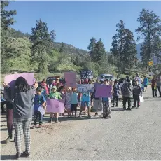  ??  ?? Protesters rally Wednesday near Lytton against trucks carrying food scraps from Metro Vancouver. The scraps are for a commercial compost operation.