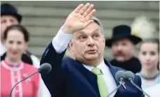  ?? — AFP ?? Hungarian Prime Minister Viktor Orban waves after his speech in front of the National Museum of Budapest during the official commemorat­ion of the 169th anniversar­y of the 1848-1849 Hungarian revolution and independen­ce war.