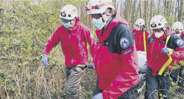  ??  ?? VITAL SERVICE: The search and rescue team on a callout, kitted out in PPE due to the ongoing Covid-19 pandemic. Picture: CVSRT