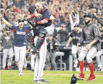  ?? AP PHOTO ?? The Boston Red Sox celebrate after Game 5 of the World Series against the Los Angeles Dodgers on Oct. 28, 2018, in Los Angeles.