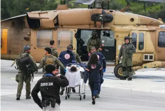  ?? (Ayal Margolin/Flash90) ?? A MILITARY helicopter evacuates the wounded from Ziv Medical Center, injured by a Hezbollah missile fired earlier that day, to a Safed IDF base, Feb. 14.