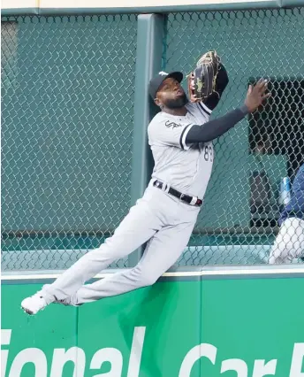  ?? GETTY IMAGES ?? Luis Robert Jr. makes a leaping catch at the wall on a ball hit by Kyle Tucker in the third inning.