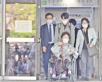  ?? — AFP photo ?? Lee leaves after a court ruling of the ‘comfort women’ case against the Japanese government over wartime sex slavery, at the Seoul Central District Court in Seoul.