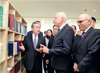  ?? ﬃMINISTRY OF FOREIGN AFFAIRS OF CHINAﬀ ?? Tunisian President Kais Saied (second left, front) and Chinese Foreign Minister Wang Yi (left) meet in Tunis, Tunisia, on 15 January