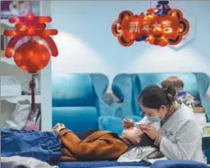  ?? XU JINBO / ASIA NEWS PHOTO ?? A woman receives aesthetic medicine treatment in Haian, Jiangsu province, on Feb 6.