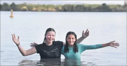  ?? Picture: PAUL CARRACHER ?? FUN: High levels of water inflow to catchments is good news for visitors, including Abby Wiedermann and Rani Potter who cooled off at Green Lake, near Horsham, at the weekend.