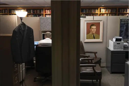  ?? ?? A portrait of John Birch hangs in an office cubicle at the headquarte­rs of the John Birch Society in Appleton, Wis., Thursday, Nov. 17, 2022. The oncepowerf­ul John Birch Society is largely forgotten today, relegated to a pair of squat buildings along a busy commercial street in small-town Wisconsin. But that is only part of their story. Because outside those cramped little offices is a national political landscape that the Society helped forge. DAVID GOLDMAN — THE ASSOCIATED PRESS