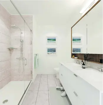  ??  ?? A light colour scheme is one of the options available for the master ensuite at Crest.