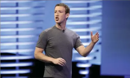  ?? THE ASSOCIATED PRESS ?? Mark Zuckerberg sees the world more connected by Facebook, because he says people are increasing­ly being left behind by globalizat­ion.