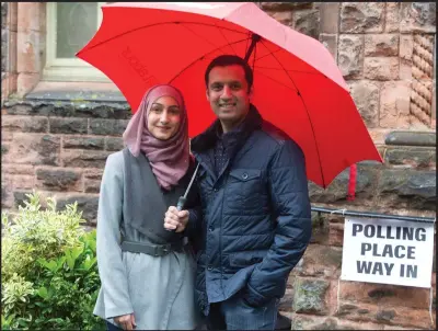  ??  ?? Labour MSP Anas Sarwar and wife Furheen cast their votes at Pollokshie­lds Burgh Hall, Glasgow Picture: Mark Gibson