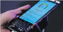  ?? THE ASSOCIATED PRESS FILE PHOTO ?? A man tries out the BlackBerry KeyOne phone before the Mobile World Congress in Barcelona, Spain, in February 2017.