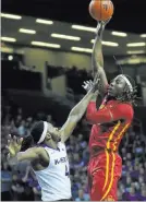  ?? ORLIN WAGNER/ THE ASSOCIATED PRESS ?? Iowa State’s Solomon Young soars for a shot over Kansas State’s D.J. Johnson on Wednesday at Manhattan, Kan.