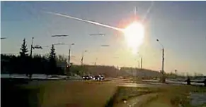  ?? AP ?? A meteor streaks through the sky over Chelyabins­k, Russia in February 2013. The US National Science and Technology Council is calling for improved asteroid detection, tracking and deflection.