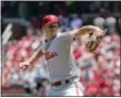  ?? TOM GANNAM — THE ASSOCIATED PRESS ?? Philadelph­ia Phillies starting pitcher Nick Pivetta sets to deliver a pitch in the first inning of a baseball game against the St. Louis Cardinals, Saturday in St. Louis.