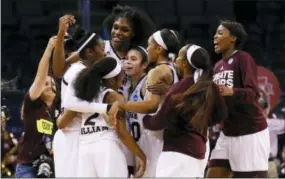  ?? SUE OGROCKI — THE ASSOCIATED PRESS ?? Mississipp­i State players celebrate after beating Washington in the NCAA women’s tournament Friday.