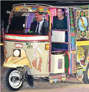  ??  ?? Arriving in style: A smiling Kate in the auto rickshaw last night