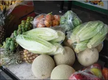  ?? HANNAH HAGEMANN — MONTEREY HERALD ?? Discounted produce, including heads of romaine lettuce, are found at a produce stand in Moss Landing on Tuesday.