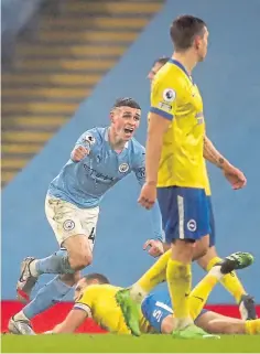  ??  ?? Phil Foden celebrates after scoring for Manchester City in the win over Brighton.