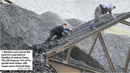  ?? HUANG SHI PENG ?? > Workers sort coal at the yard of a coal mine in Huaibei in central China. The UK imports 13% of its goods from China, still major users of fossil fuels