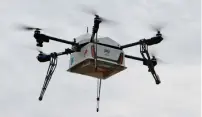  ?? AFP ?? A drone designed to deliver pizzas from Domino’s Pizza in flight in Whangapara­oa, New Zealand. —