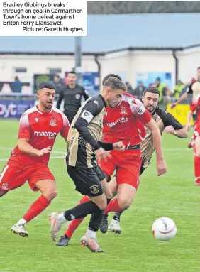  ?? ?? Bradley Gibbings breaks through on goal in Carmarthen Town’s home defeat against Briton Ferry Llansawel.
Picture: Gareth Hughes.