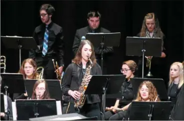  ?? KRISTI GARABRANDT — THE NEWS-HERALD ?? Chardon High School junior and member of the jazz orchestra performs a saxophone solo during the orchestras appearance at Lakeland Jazz Festival.