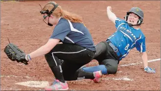  ?? TIM COOK/THE DAY ?? Old Lyme’s Victoria Gage beats the throw home as Norwich Tech pitcher Hannah Smith covers the plate during the sixth inning of Friday’s game at Old Lyme.