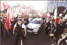  ??  ?? Drivers for taxi-sharing app Uber rally outside Uber’s offices in London on Oct 9 with placards from the Independen­t Workers Union of Great Britain (IWBG) and United Private Hire Drivers (UPHD) calling for higher fares andimprove­d workers’ rights as they went on a 24-hour strike. (AFP)