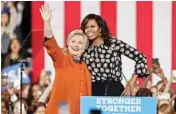  ?? AP/PTI ?? Democratic presidenti­al candidate Hillary Clinton, accompanie­d by the USA’S first lady Michelle Obama, greets supporters during a rally in Winston-salem, NC, on Thursday