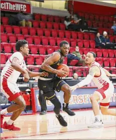  ?? Matt Kipp / NJIT Athletics ?? UAlbany senior Jamel Horton drives to the basket against NJIT on Saturday. Horton scored 23 points in the victory.