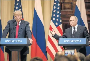  ?? Picture: GETTY IMAGES ?? AT THE COALFACE: US President Donald Trump, left, and Russian President Vladimir Putin answer questions about allegation­s around Russia’s collusion in the 2016 US elections, in Helsinki.